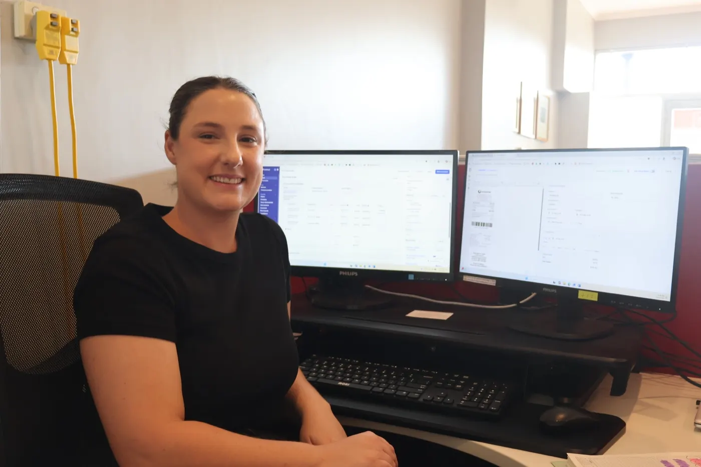 Gemma at her desk at Home Care Assistance Newcastle